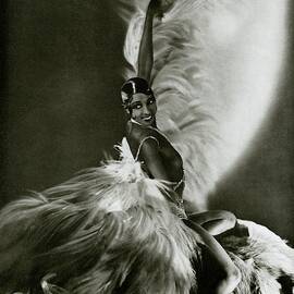 Josephine Baker Wearing A Feathered Cape by George Hoyningen-Huene